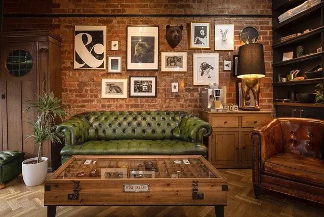 The green Chesterfield and picture wall at Bear and Hare